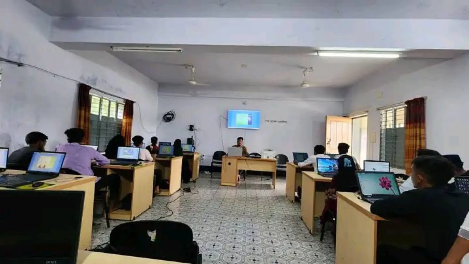 Students at work on desktop computers in the classroom of the Abul Khair Computer Training Center