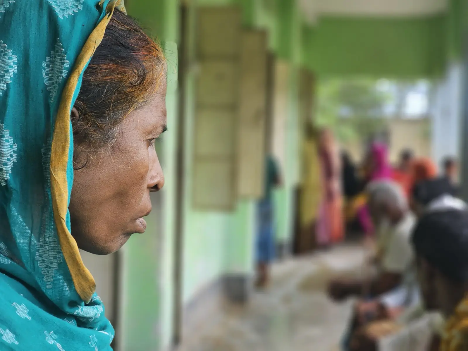 An elderly woman waits for her consultation at the free Friday clinic in Baishmouja