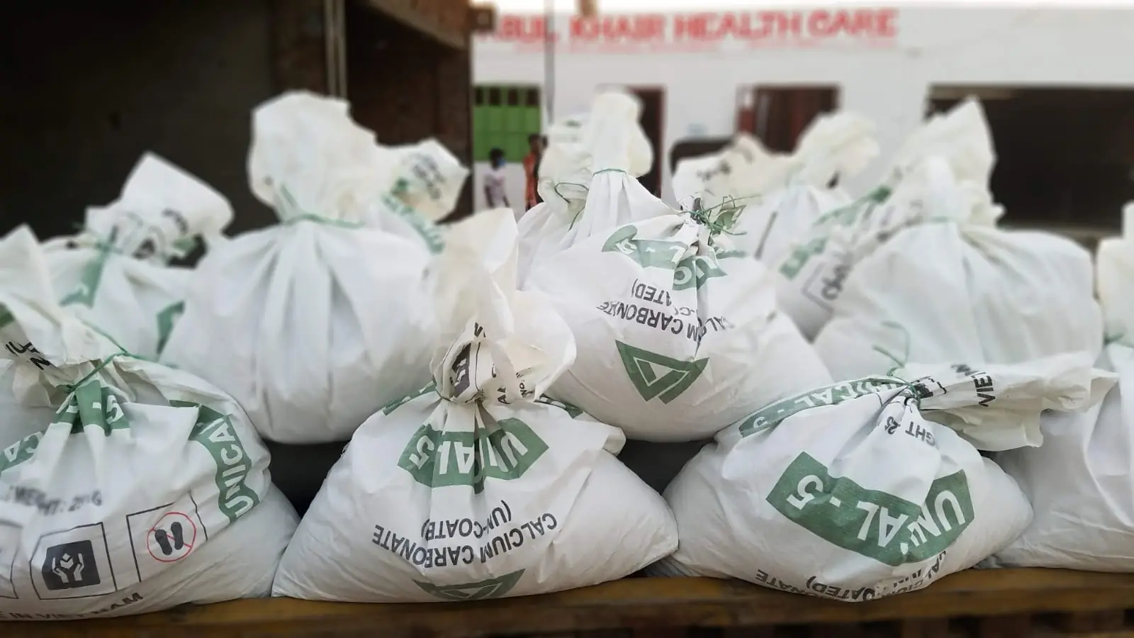 Food relief parcels packed and stacked outside the Abul Khair Health Care office