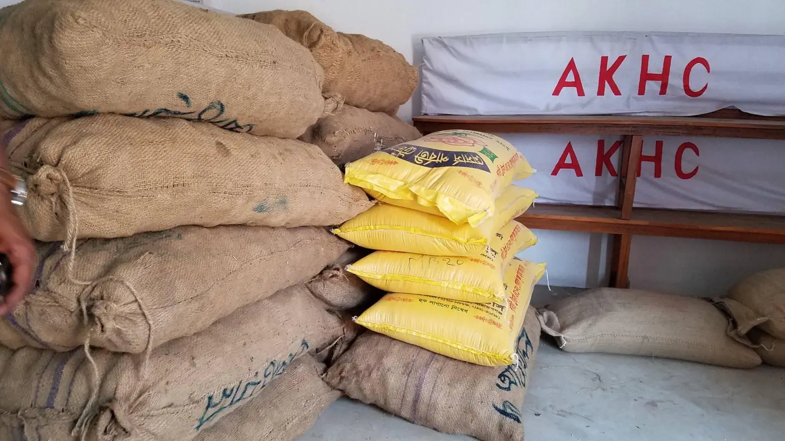 Sacks of rice and staples stacked at the AKHC office before a food distribution
