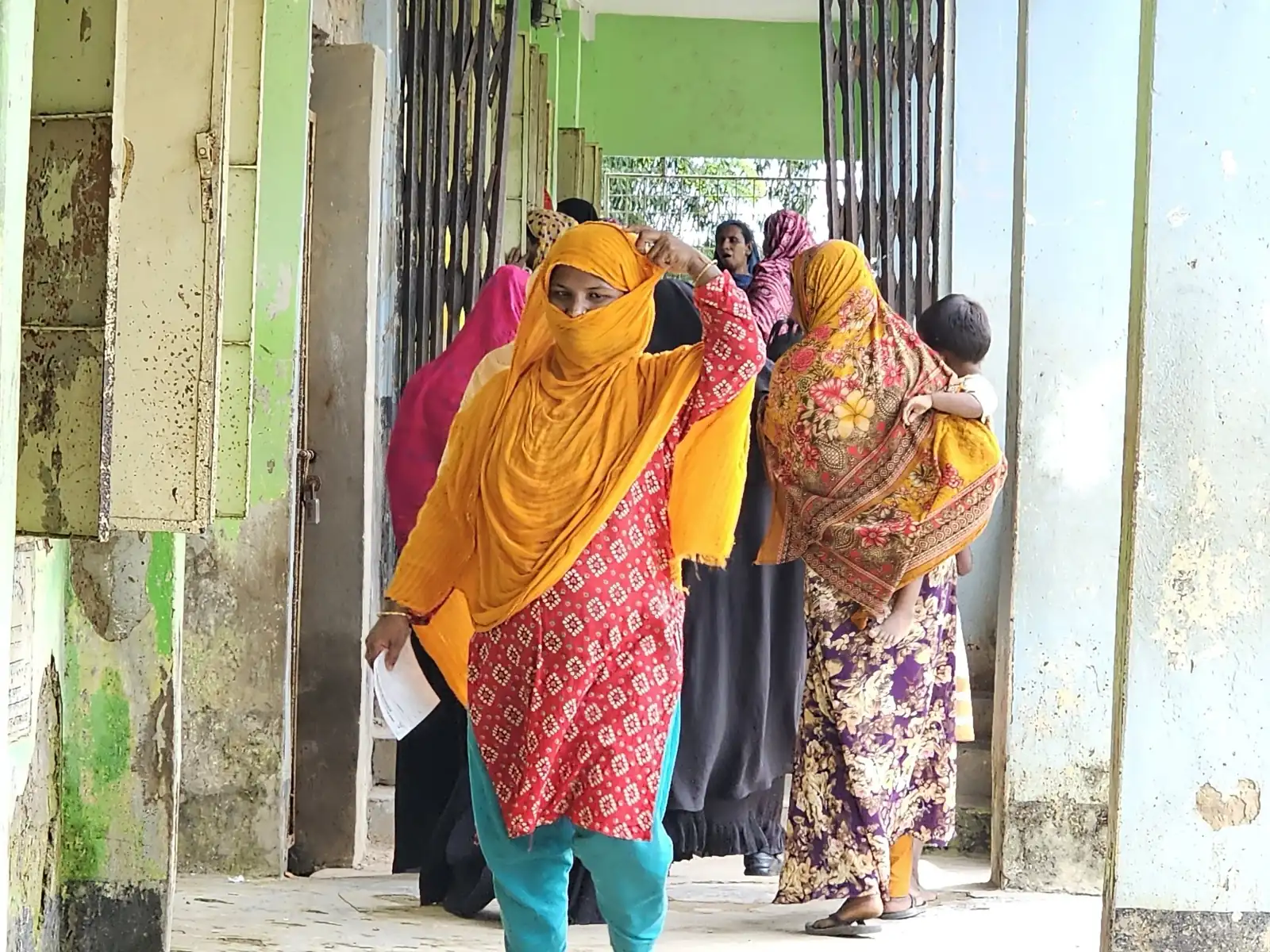 Women queue in the veranda of the Baishmouja clinic on a Friday morning